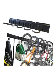 the bike rack is holding several bikes and other accessories, including a pair of umbrellas