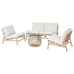 an outdoor furniture set with white cushions and wickers, including a coffee table