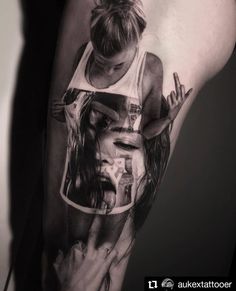 a woman's arm with a black and white tattoo design on the left side of her body