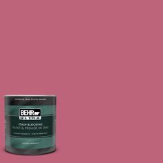 a can of behr paint on a pink background