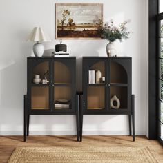 a black cabinet with glass doors in a living room