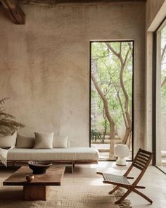 a living room filled with furniture and windows