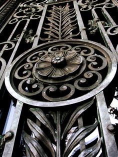 an ornate iron work on the side of a building