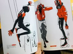 an open book with drawings of people in different outfits on them, and the pages are black and white