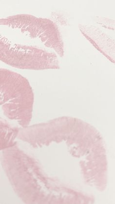 pink lipstick prints on a white background