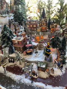 a christmas village with lots of toys and trees