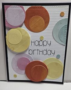 a happy birthday card with circles on it