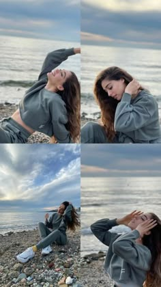 a woman sitting on top of a rocky beach next to the ocean with her hands in her hair