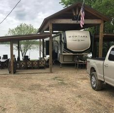 a truck parked in front of a boat house