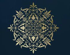 an intricate gold design on black paper with the word, you can use it as a background