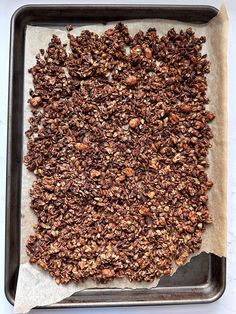 an uncooked chocolate granola on a baking sheet