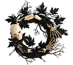 a skeleton wreath with leaves on it