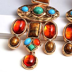 Technology: Colourful stones earringType: Vintage earringsEarring Type: Drop EarringsItem Type: EarringsFine or Fashion: FashionMetals Type: Zinc alloyMaterial: CRYSTALStyle: TRENDYShapepattern: IrregularGender: WomenModel Number: E2000581