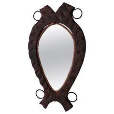 a mirror that is shaped like a heart