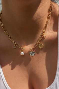 This necklace is for the first girls in the water on a sunny day. With five hand-picked symbols of the beach on the perfect accent chain, this piece was made for the girls love days spent by the ocean, endless swimsuit tan lines, and feel happiest by the water. 14k Gold Plated Nickel-free Length: 18" Beach Jewellery, Pretty Jewelry Necklaces, Earthy Jewelry, Minimal Accessories, Beads Bracelet Design, Golden Jewelry