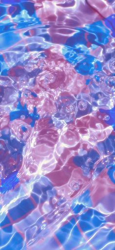 an abstract photo of water and bubbles in blue, pink, and purple colors with white circles on the surface