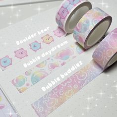 two rolls of washi tape sitting next to each other on top of a table