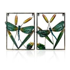 two metal art pieces with dragonflies on them, one is green and the other is yellow