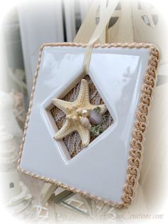 a starfish in a white ceramic box