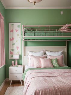 a bedroom with green walls, pink and white bedspread, and bunk bed