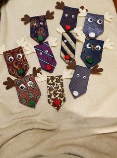 several different types of ties are arranged on a bed with reindeer noses and antlers