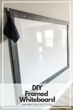 a whiteboard with the words diy framed whiteboard hanging on it's side