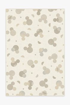 a beige and grey polka dot pattern with the words ruggable on it