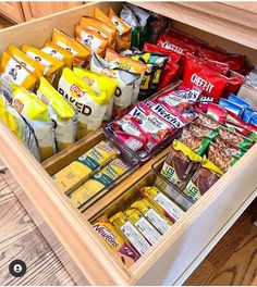 an open drawer in a kitchen filled with food