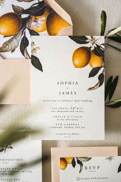 wedding stationery with oranges and leaves