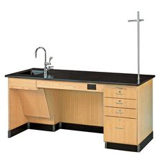 an office desk with two sinks and a cross on top