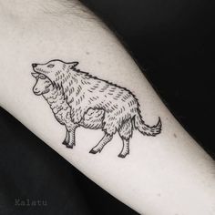 a black and white drawing of a sheep on the left inner arm, with its mouth open