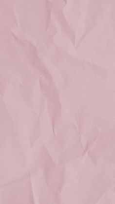 a piece of pink paper that is wrinkled