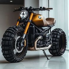 an orange and black motorcycle parked in front of a building