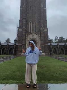 a person standing in front of a large building