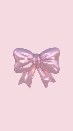 a shiny pink bow on a light pink background