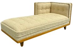 a beige chaise lounger with wooden legs on an isolated white background for display