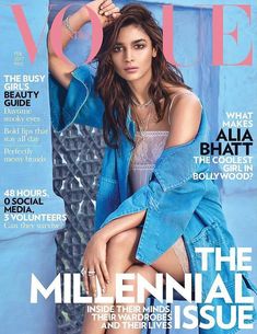 a woman sitting on top of a magazine cover wearing a blue shirt and jeans jacket