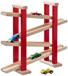 toy cars are lined up on the wooden shelf to play with it's track