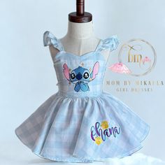 a dress made to look like stitching with the name mom by mikea on it