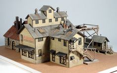 a paper model of a house on top of a table