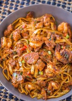 pasta with shrimp and peppers in a bowl