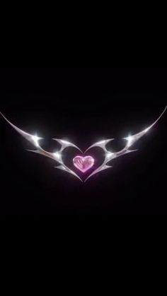 an image of a heart with wings in the dark