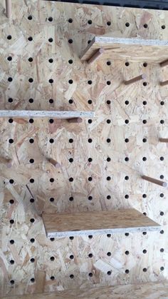 the shelves are made out of plywood and have holes in them