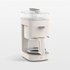 a white coffee maker sitting on top of a counter