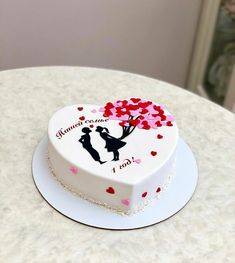 a heart shaped cake sitting on top of a table