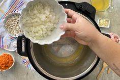 someone is adding ingredients to an electric pressure cooker