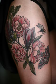 a woman's thigh with flowers and a butterfly on it