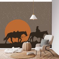 two cowboys on horses in front of an orange sunset wallpapered living room scene