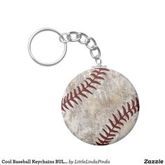 a baseball keychain is shown on a white background