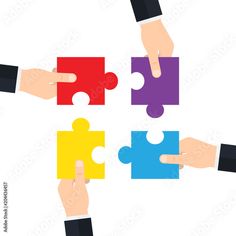 four hands holding puzzle pieces together to form a square shape with one hand pointing at the other